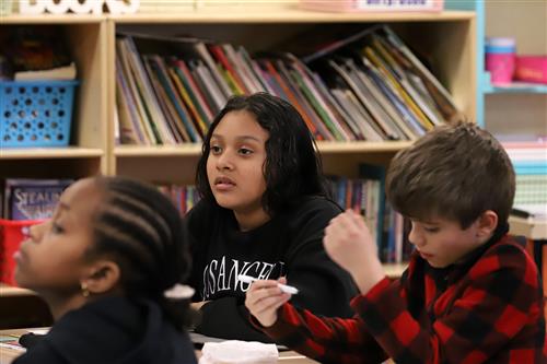 Newell Elementary students sitting at desks and listening in classroom